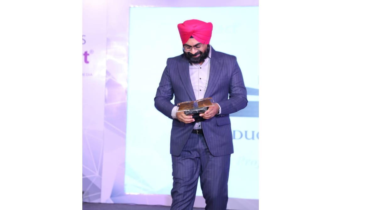 Dr. Jaspal Singh receiving award on stage